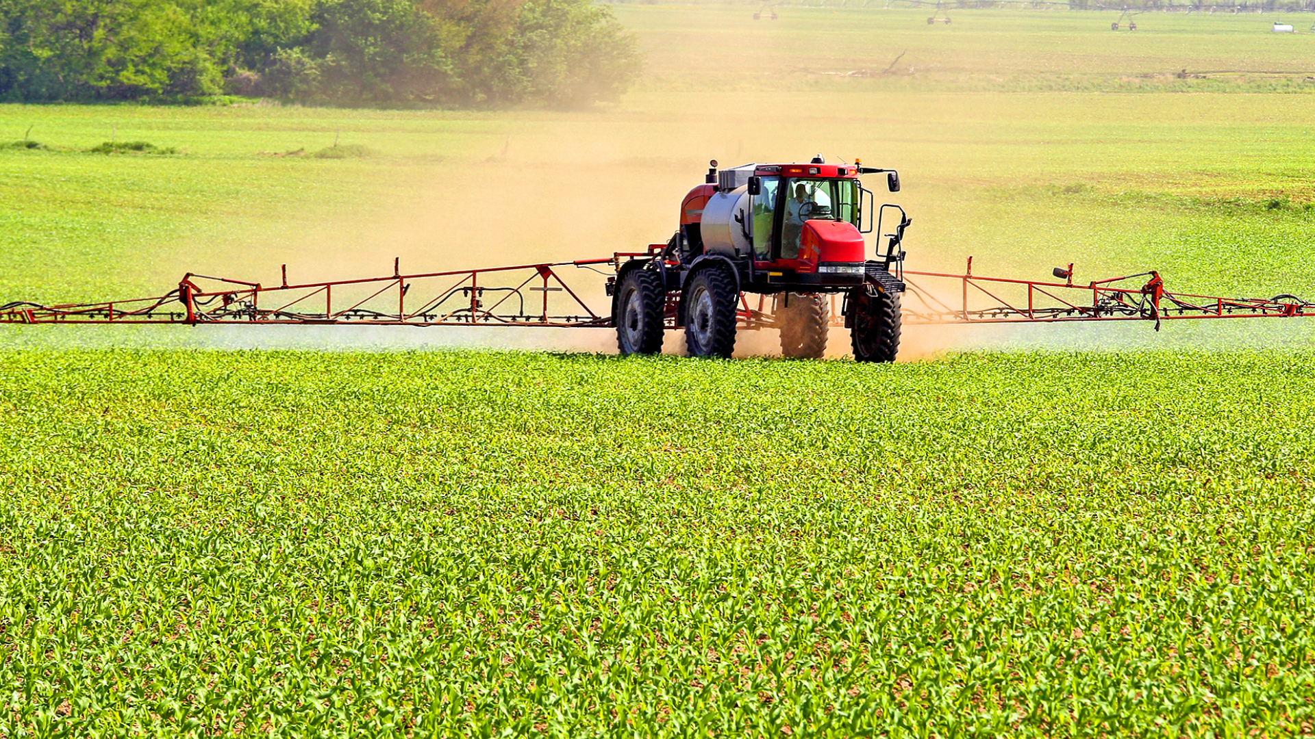 Red Tractor applying SumaGroulx